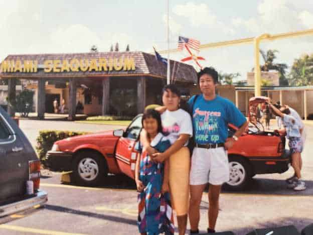 In one of their first family photos taken in the US, Finli CEO and founder Lori Shao smiles under an American flag with her parents.